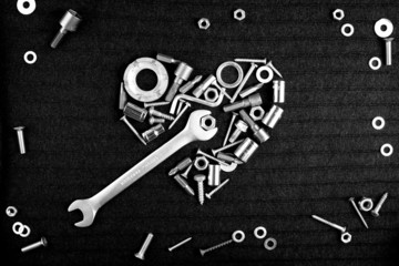 heart of the tools and screw nuts in black