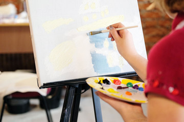 Woman paints a picture