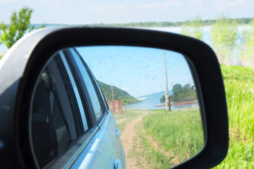 Reflection in the side mirror of car