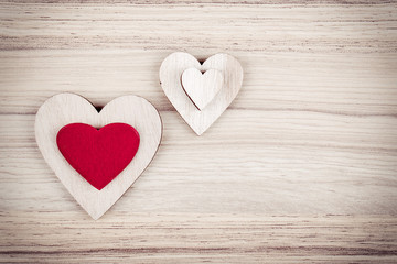 valentine's wooden hearts on a wooden background