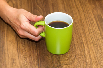 Woman Hand Holding Green Mug