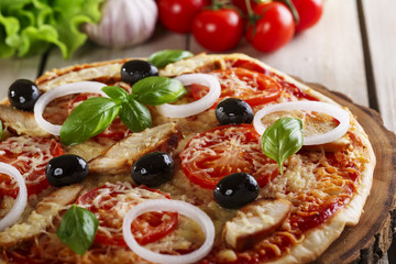 Pizza with chicken cheese and tomatoes 