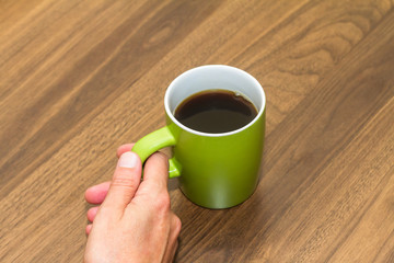 Woman Hand Holding Green Mug