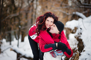 Outdoor fashion portrait young couple in winter