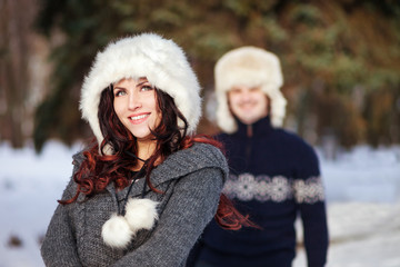 Outdoor fashion portrait young couple in winter