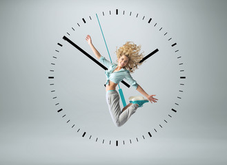 Blond athlete jumping in the clock