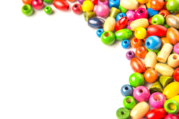 Colorful wooden beads on white background