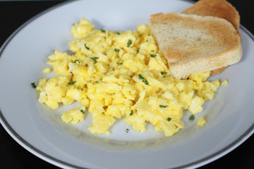 Scrambled eggs with toasted white bread