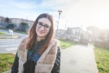 Fototapeta premium Young Woman Portrait at Park in the Morning.