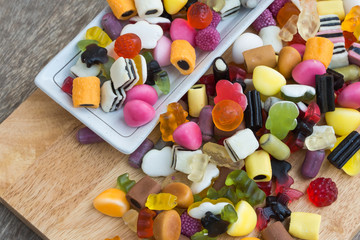 Mix jelly fruits  on wooden background