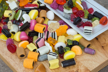Mix jelly fruits  on wooden background
