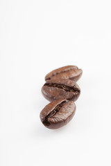 Close up of Three roasted coffee beans