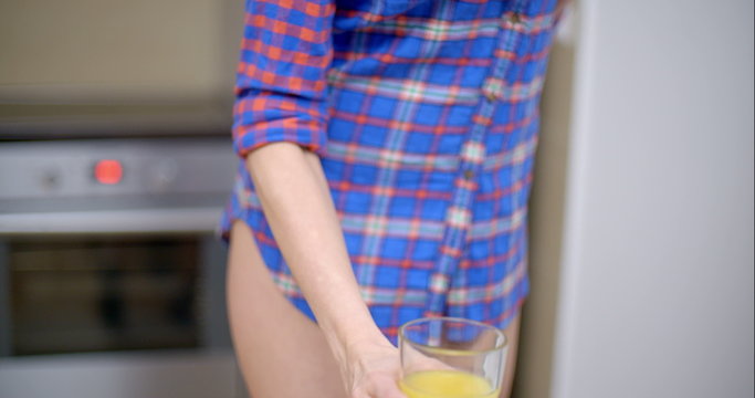 Sexy Bottomless Woman Drinking Orange Juice