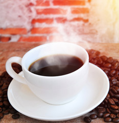 Coffee cup with grunge brick wall background