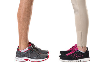 Fototapeta na wymiar Man and woman in sneakers opposite each other 