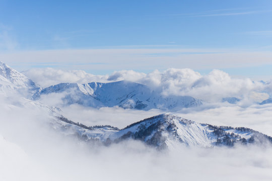 View on mountains and blue sky above clouds