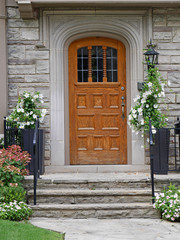 Fototapeta na wymiar front door with flower pots