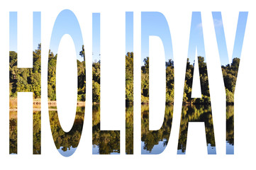 Holiday word in tree reflection background
