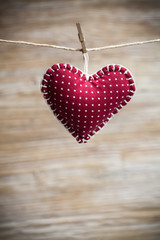 Colorful fabric hearts on wood backgrounds