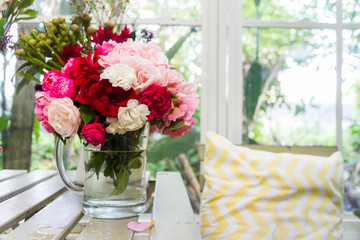 colorful rose in glass