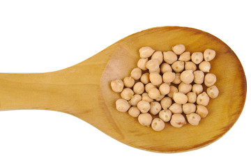Uncooked chickpeas on wooden spoon isolated on white background