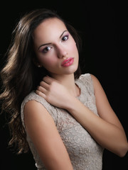 Indoor fashion portrait of beautiful young woman