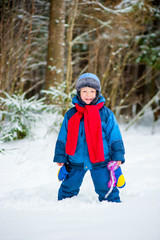 Fototapeta na wymiar cheerful boy 4 years old laughing in winter