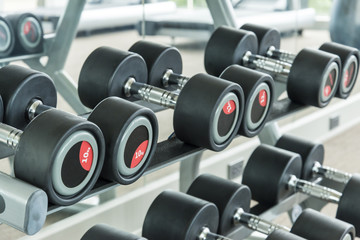 dumbbells in modern sports club. Weight Training Equipment
