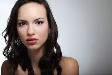 Indoor fashion portrait of beautiful young woman