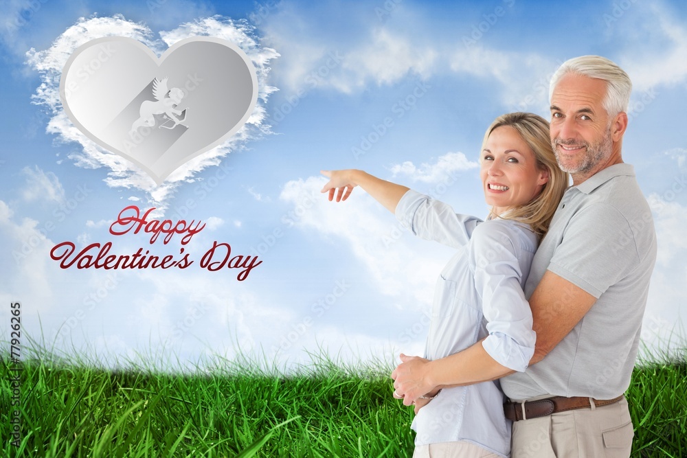 Aufkleber Composite image of happy couple smiling at camera and pointing
