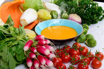 plate of pumpkin soup with vegetables