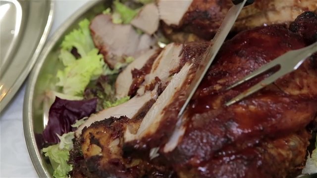 Sliced by knife, juicy beef covered in salad and herbs