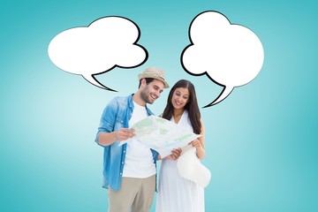 Composite image of happy hipster couple looking at map