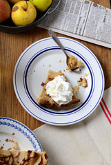 apple pie on a table with apples