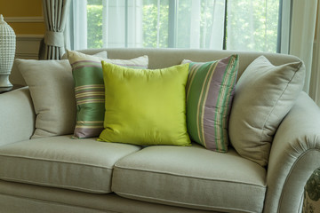 green pillows on modern sofa in living room