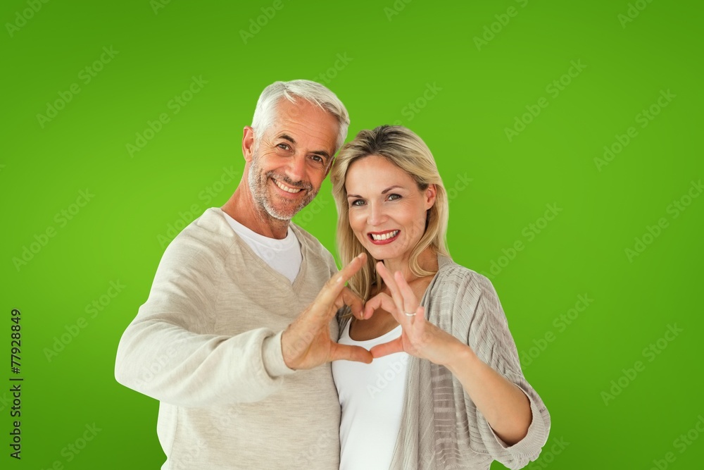 Aufkleber composite image of happy couple forming heart shape with hands