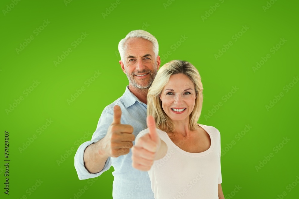 Aufkleber composite image of smiling couple showing thumbs up together
