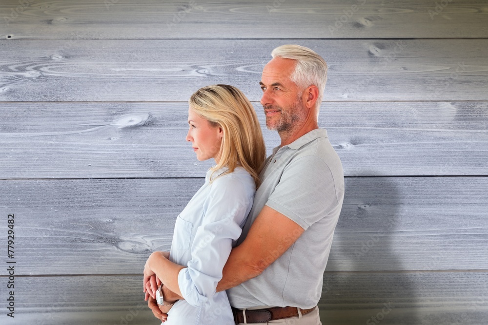Aufkleber composite image of happy couple smiling and embracing