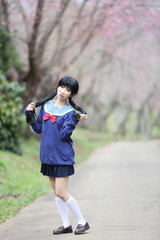 Fototapeta na wymiar japanese school girl with flower