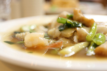 Thai food Wide Noodles in a Creamy Sauce with seafood