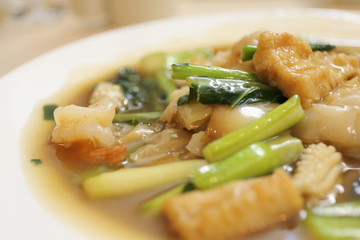 Thai food Wide Noodles in a Creamy Sauce with seafood