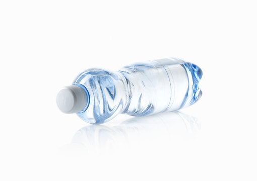 Water. Small plastic water bottle on white background