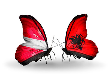 Two butterflies with flags Latvia and Albania