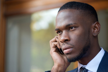 African american businessman talking on cell phone
