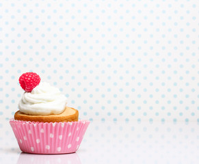 Cupcake  with butter cream and raspberry