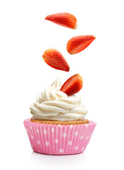 Cupcake  with butter cream and falling strawberry