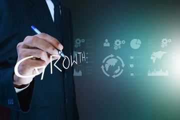 business man writing growth concept