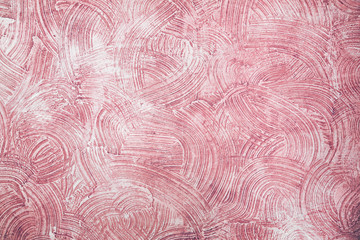 Decorative pink plaster texture on the wall - background