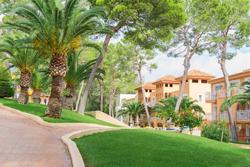 Fototapeta na wymiar Modern luxury hotels with pool and park.