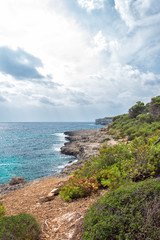 Fototapeta na wymiar Beautiful wild tropical coast. Mediterranean sea landscape.
